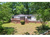 Charming single-story home with a welcoming front porch and landscaped front yard at 1773 Baldwin Ln, Lincolnton, NC 28092