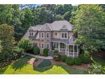 Charming two-story home with landscaped yard and inviting gazebo entrance at 2541 Penngate Dr, Sherrills Ford, NC 28673