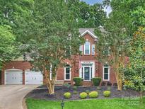 Charming two-story brick home with a well-manicured front yard and inviting curb appeal at 314 Southern Cross Ln, Matthews, NC 28105