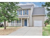 Charming two-story home with blue shutters and a covered front porch at 7806 Mcgarry Trl, Charlotte, NC 28214