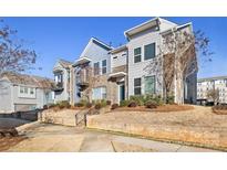Charming townhome with landscaped front yard and inviting entrance; a great place to call home at 1428 Winding Stream Rd, Charlotte, NC 28206