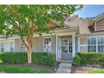 Charming home with well-maintained landscaping, covered front entry, and neutral siding at 1925 Sandal Brook Rd, Indian Land, SC 29707