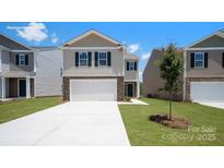 New construction home with neutral siding, stone accents, and a pristine, long driveway at 4689 Fanning Rd, Hickory, NC 28602