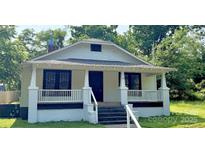 Charming single-story home with inviting front porch and freshly painted exterior at 1012 4Th St, Statesville, NC 28677