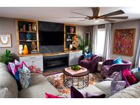 Inviting living room with custom built-ins, fireplace, and eye-catching decor at 12150 Plover Dr, Charlotte, NC 28269