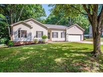 Charming single-Gathering home with a well-manicured lawn and inviting curb appeal at 146 Valley Glen Dr, Troutman, NC 28166