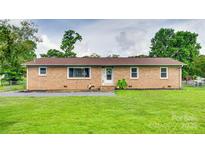 Charming one-story brick home with a well-manicured lawn at 739 Springdale Rd, Rock Hill, SC 29730
