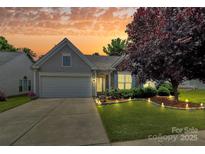 Charming single-Gathering home with a well-manicured lawn, beautiful landscaping, and inviting curb appeal at 8722 Heron Glen Dr, Charlotte, NC 28269