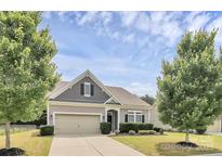 Charming single Gathering home featuring manicured lawn, two-car garage, and craftsman style architecture at 1397 Tupelo Rd, Clover, SC 29710