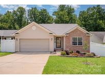 Charming single-Gathering home featuring a well-manicured lawn and a two-car garage in a desirable neighborhood at 146 Pheasant Ridge Cir, York, SC 29745