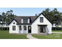 Charming new construction home featuring white siding, black trim, stone accents and a welcoming front porch at 2159 Dunlap Roddey Rd, Rock Hill, SC 29730