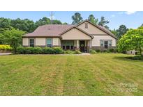 Charming single-Gathering home with a well-manicured lawn and lush landscaping, offering great curb appeal at 137 Leaning Tower Dr, Mooresville, NC 28117
