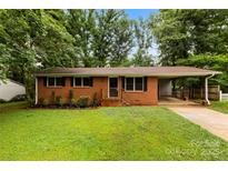 Charming brick home with a well-maintained lawn and a convenient carport at 1156 Westover Cir, Rock Hill, SC 29732