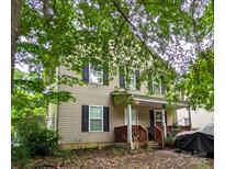 Charming two-story home with a cozy front porch and mature trees at 3241 Reid Ave, Charlotte, NC 28208
