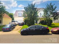 Two-story house with ample parking and a well-maintained lawn at 3509 Joel Turner Dr, Charlotte, NC 28216