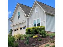 Charming home featuring a well-manicured lawn, beautiful landscaping and a two car garage at 15250 Windward Ln, Lancaster, SC 29720