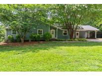 Charming single-Gathering home with well-maintained lawn and mature trees at 6313 Weddington Rd, Concord, NC 28027