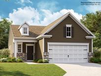Charming one-story home with a two-car garage and well-manicured lawn at 8426 Norman Forest Rd, Lancaster, SC 29720