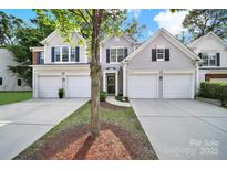 Charming townhome featuring an attached garage and welcoming front entrance at 10135 Blakeney Preserve Dr, Charlotte, NC 28277