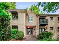 Charming condo with a private balcony and well-maintained landscaping at 201 N Dotger Ave # C8, Charlotte, NC 28207