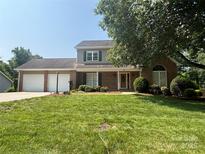 Inviting two-story home boasts a lush front lawn and an attached two-car garage at 228 31St Avenue Ne Ct, Hickory, NC 28601