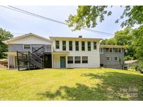 Expansive backyard view showcasing the multi-level deck and well-maintained lawn at 2617 Shady Lane Ave, Concord, NC 28027