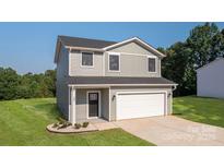 Charming two-story home with gray siding, a front-facing garage, and a well-manicured lawn at 823 32Nd Ne St, Conover, NC 28613
