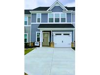 Charming two-story home with a gray color scheme and a white garage door with modern appeal at 1598 Respect St, Concord, NC 28027