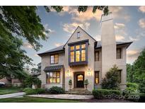 Stunning exterior of this luxurious home featuring beautiful architecture and professional landscaping at 1728 Shadow Forest Dr, Matthews, NC 28105