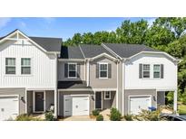 Charming townhome featuring a classic design and a well-manicured front yard at 853 Gerard Bay Dr, Fort Mill, SC 29715