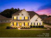 Charming two-story home with well-manicured lawn and inviting front porch at 112 Doyle Farm Ln, Mooresville, NC 28115