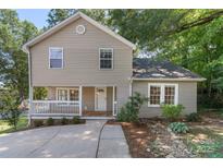 Charming home featuring a welcoming front porch, landscaped yard, and inviting curb appeal at 202 Glenn Ave, Kannapolis, NC 28081