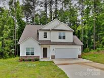 Charming two-story home with a two-car garage and inviting curb appeal at 2612 Cold Springs Rd, Concord, NC 28025