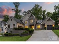 Beautiful brick home with a well-manicured lawn and professional landscaping at 5638 Timber Ln, Charlotte, NC 28270
