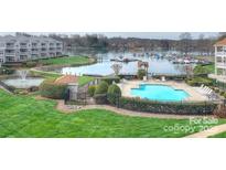 A luxurious condo community featuring a pool, fountain, and marina on the beautiful waterfront at 1038 Southwest Dr, Davidson, NC 28036