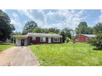 Charming single-story brick home with a carport and a spacious front yard at 1073 Springdale Dr, Maiden, NC 28650