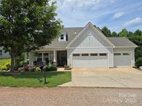 Charming single-Gathering home with well-maintained lawn and three-car garage at 16115 Commodore Dr, Lancaster, SC 29720