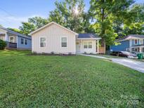 Charming home featuring a well-manicured lawn and inviting curb appeal at 3133 Amay James Ave, Charlotte, NC 28208