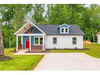 Charming single-Gathering home with a welcoming front porch and bright red door at 516 North Mulberry St, Cherryville, NC 28021