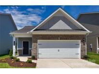 Charming single-Gathering home showcasing a brick facade and a convenient two-car garage, offering a blend of style and functionality at 1255 Langston Ln, Salisbury, NC 28144