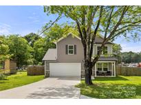 Charming home with a two-car garage, inviting front porch, and well-maintained lawn at 4209 Grier St, Gastonia, NC 28056