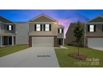 Charming two-story home featuring a two-car garage, stone accents, and well-manicured lawn at 432 Court House Ave, York, SC 29745