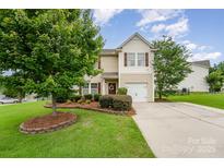 Charming two-story home with manicured lawn and inviting curb appeal at 611 Sawtooth Oak Dr, Landis, NC 28088