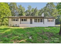 Charming brick home featuring a well-manicured lawn, and a neutral color scheme, perfect for a Gathering at 848 Ike Lynch Rd, Dallas, NC 28034