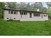Charming one story home with painted brick and a lush green lawn at 848 Ike Lynch Rd, Dallas, NC 28034