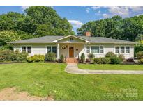 Charming single-story home with a well-manicured lawn and inviting front porch at 1107 Fairfield Dr, Gastonia, NC 28054
