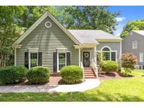 Charming single-story home featuring a well-maintained lawn and classic architectural details at 12524 Angel Oak Dr, Huntersville, NC 28078