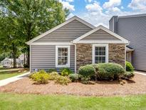 Charming home with stone accents, landscaped yard, and a mix of textures for an inviting curb appeal at 1836 Fairlawn Ct, Rock Hill, SC 29732
