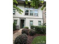 Charming townhouse featuring a professionally landscaped front yard and inviting entry way at 2514 Marshall Pl, Charlotte, NC 28203