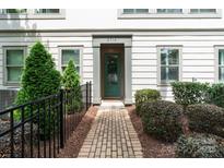 Inviting home exterior featuring a well-manicured walkway and lush landscaping leading to a charming green front door at 2514 Marshall Pl, Charlotte, NC 28203